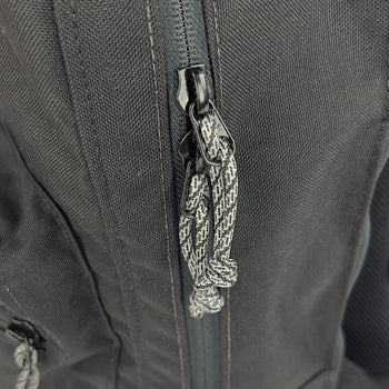 Reverse zipper with handmade pulls